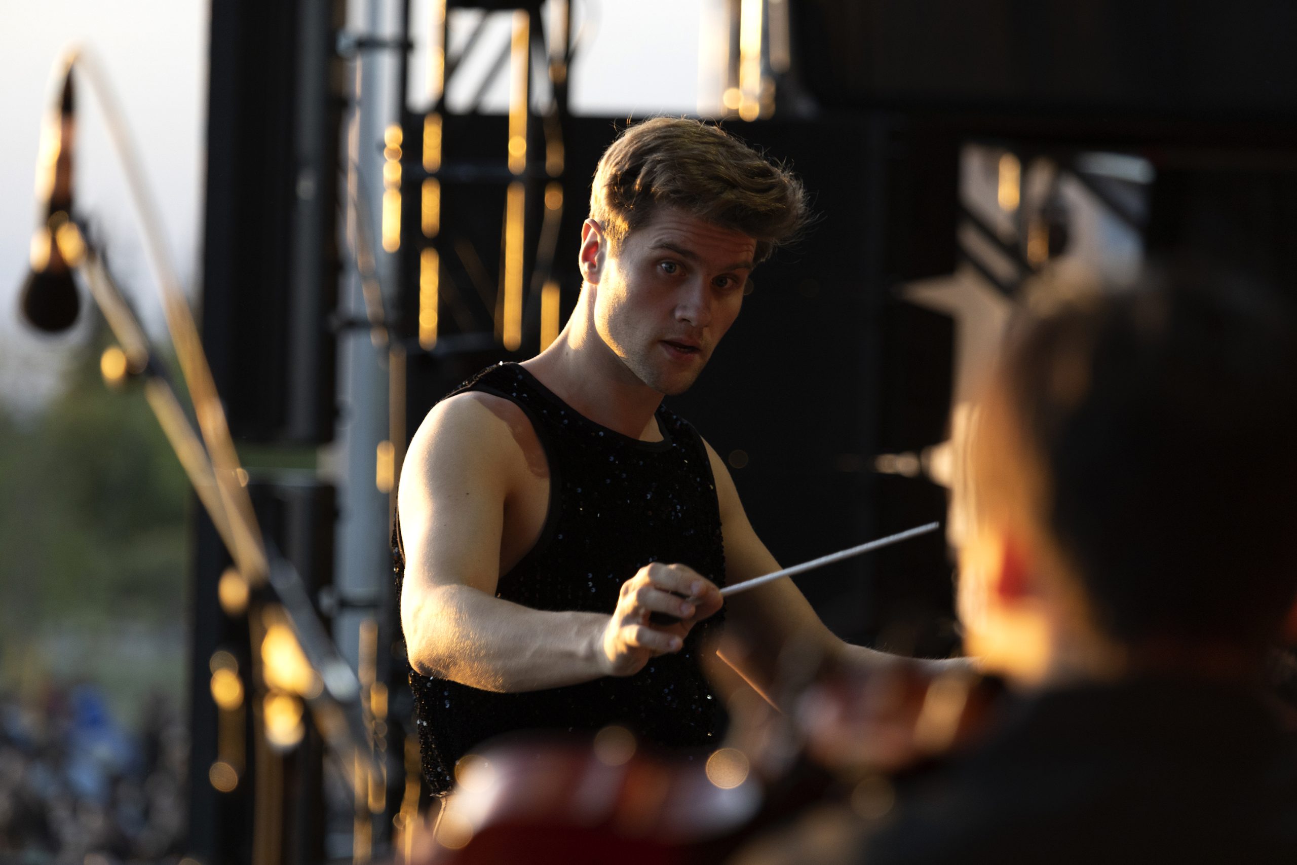 Conductor Bjarni Frímann in a passionate performance on stage